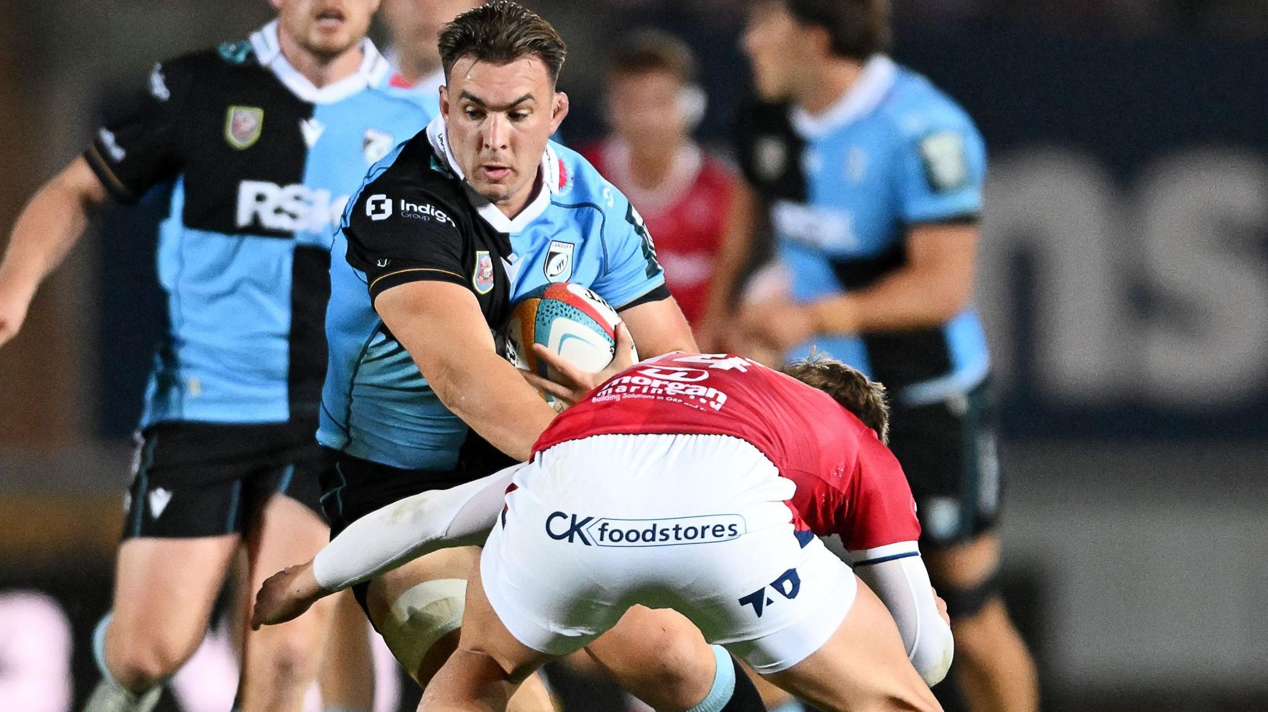Taine Basham carries the ball into contact
