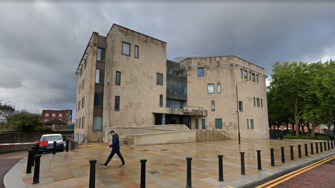 Man, 29, jailed for raping two 14-year-old girls A court house surrounded by black bollards on a wet day.