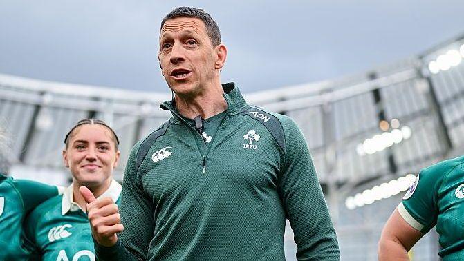 Ireland head coach Scott Bemand wears a dark green long-sleeved shirt