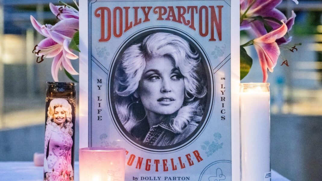 Dolly Parton gets new star on Hollywood Walk of Fame after vandalism An illustration of Dolly Parton with her name stands on a table in front of a vase of pink lilies and behind three candles during the during a Seattle Community Vigil for Dolly Parton on Friday