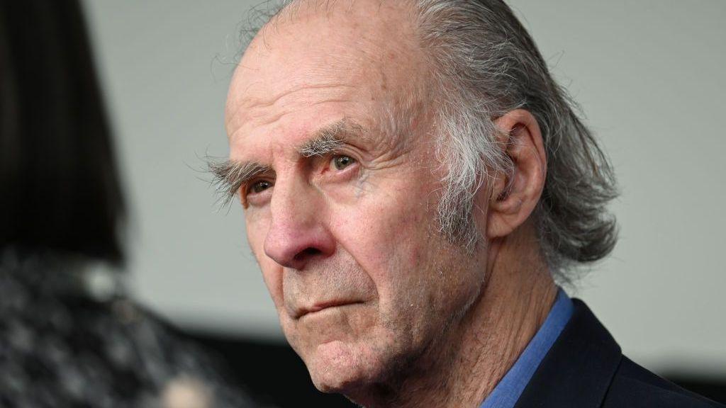 Sir Ranulph Fiennes in a blue shirt and blazer as he attends a premiere
