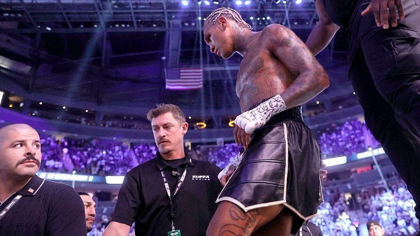 Conor Benn is wearing black shorts as he walks out the ring