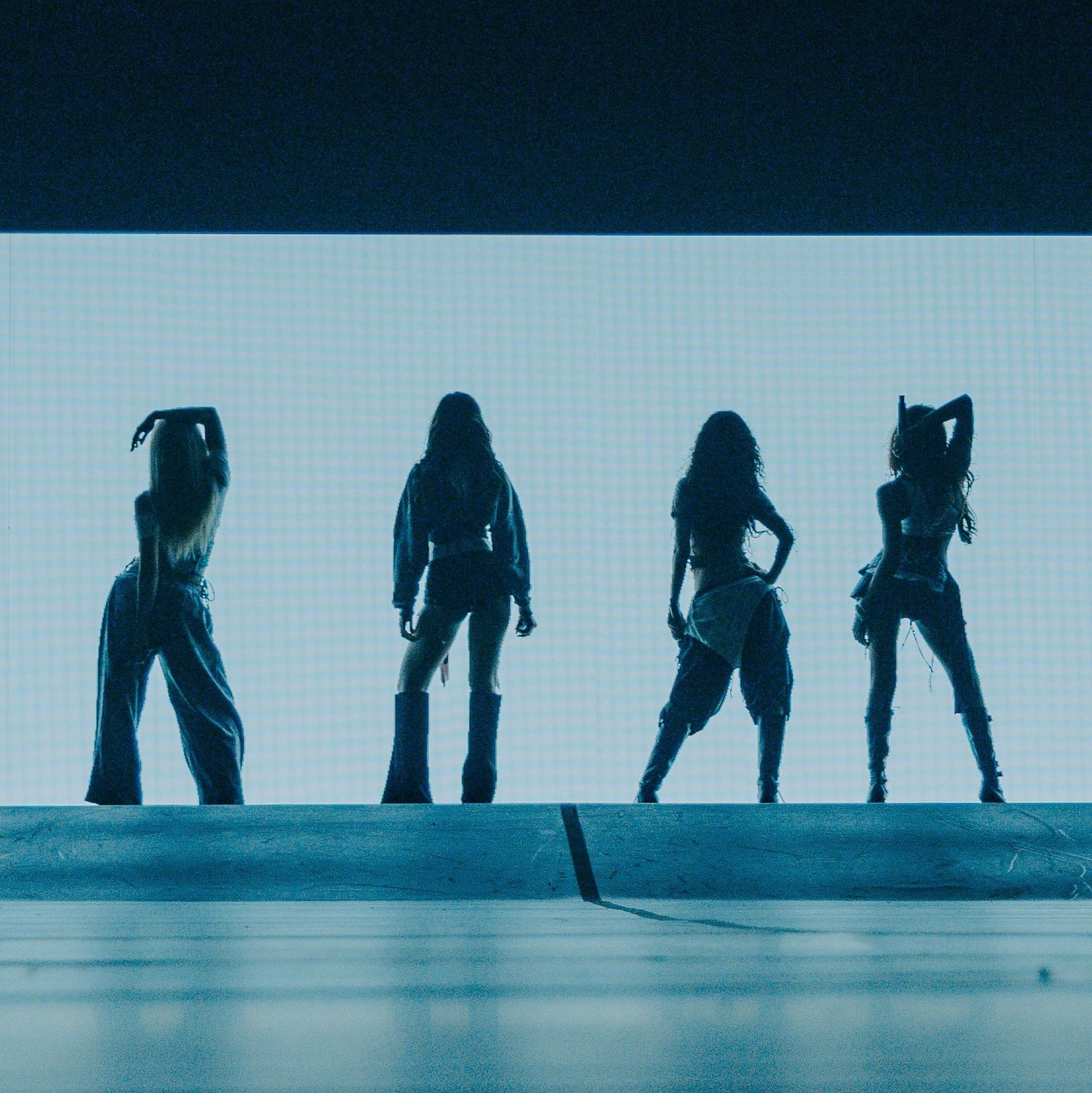 A silhouette of Katseye during a show on their Wildworld tour