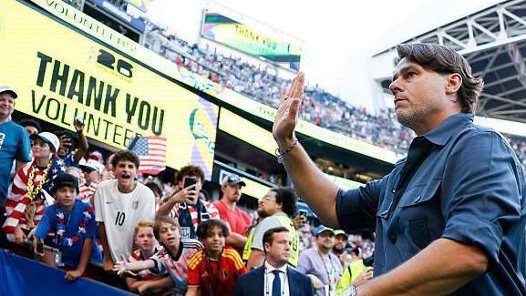 US boss Mauricio Pochettino waves to fans as he leaves the pitch