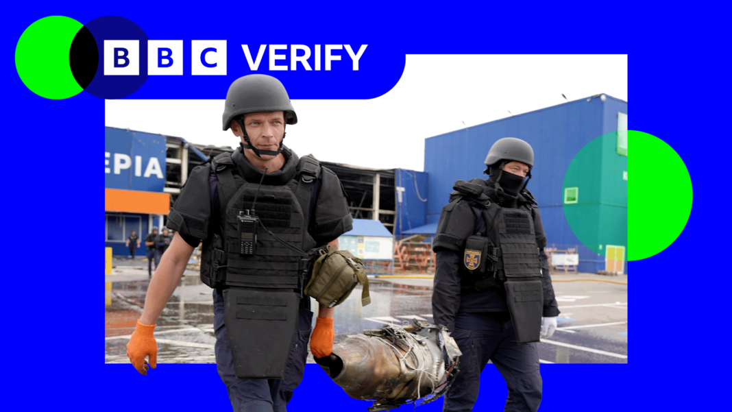 Russians seek answers over hundreds missing after Ukraine’s 2024 incursion Two Ukrainian first responders carry the remains of a Russian jet-powered drone engine after an attack. They are wearing body armour and helmets and are holding opposite ends of the engine.