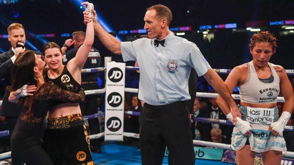Katie Taylor's mother Bridget hugs her as she is announced the winnner