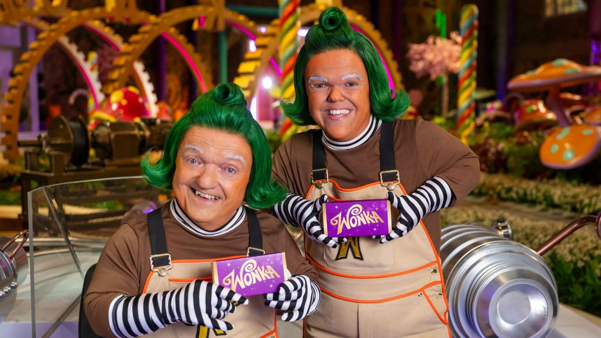 Rusty Goffe and his son Ben posing together in costume on set of the Netflix Wonka show.