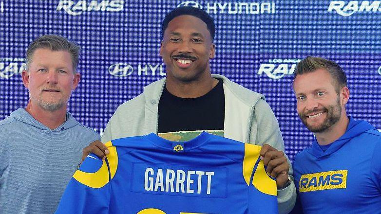 General manager Les Snead, new signing Myles Garrett and head coach Sean McVay, with Garrett holding a jersey as he is presented to the media after his trade to the Los Angeles Rams