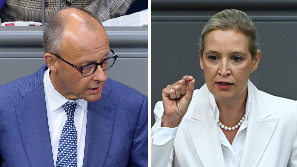 A man in a blue jacket and tie on the left and a woman dressed in white on the right