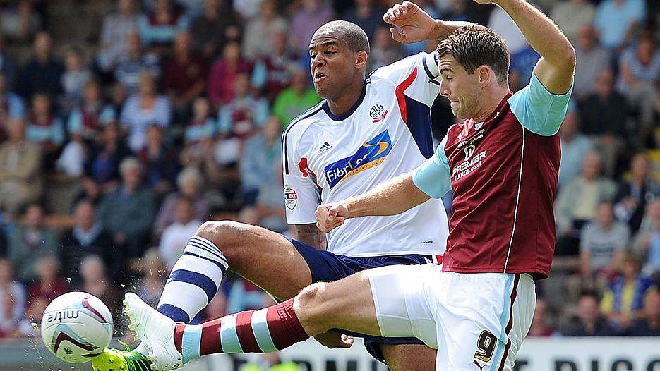 Zat Knight of Bolton and Sam Vokes of Burnley contest a bouncing ball during a 1-1 draw in August 2013
