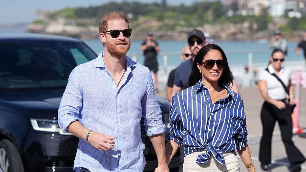 Prince Harry, Duke of Sussex and Meghan, Duchess of Sussex arrive to meet volunteer first responders from Bondi Surf Bathers' Life Saving Club, during a visit to Bondi Beach