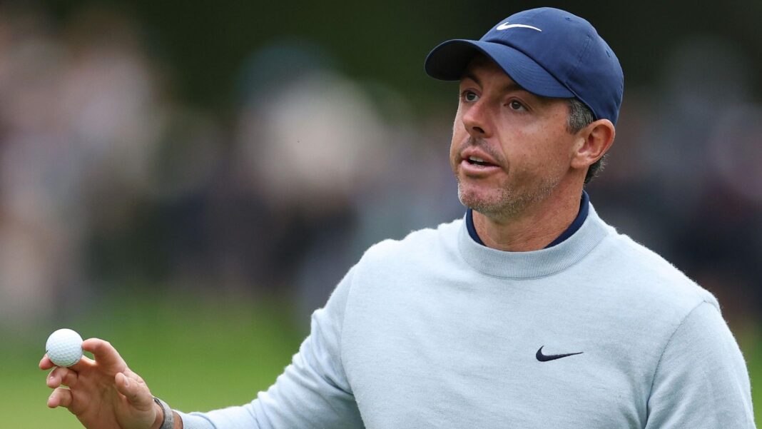 Rory McIlroy walks off a green