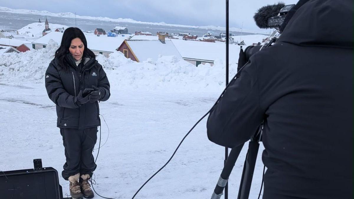 Maryam Moshiri in front of a camera