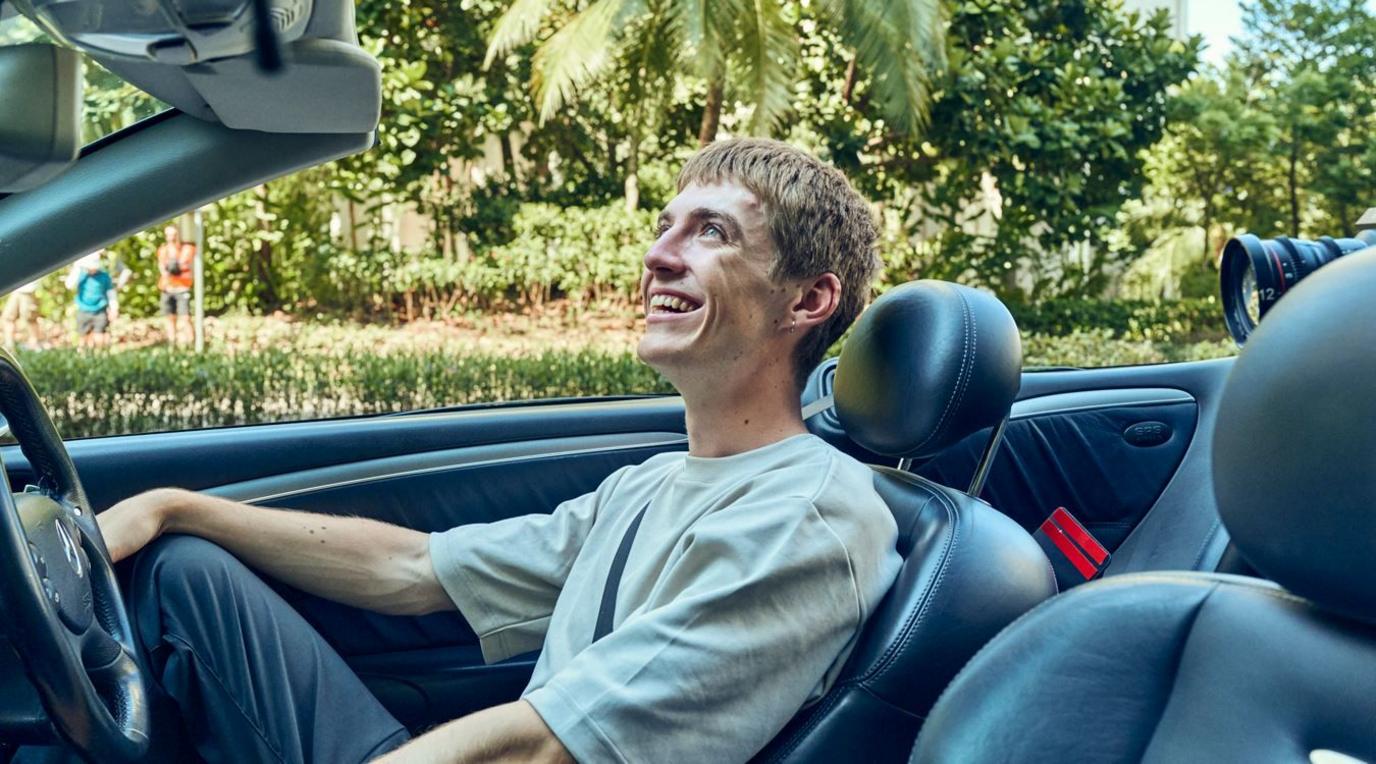 Francis Bourgeois sat in a car smiling