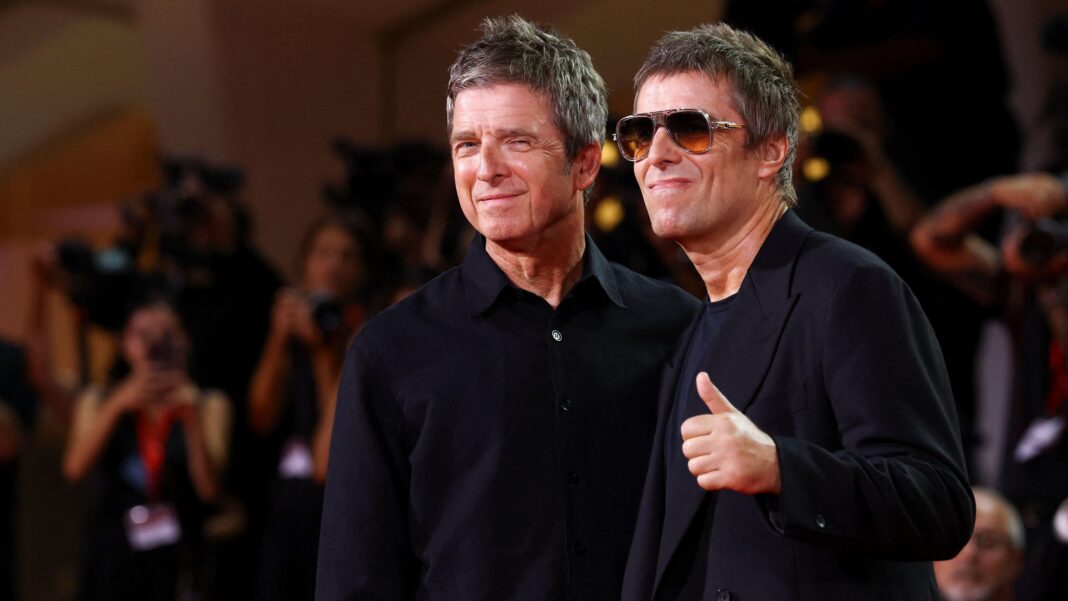 Noel and Liam Gallagher at the Venice Film Festival, they are both wearing black and Liam is wearing black