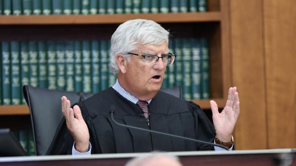 image shows the judge in the case