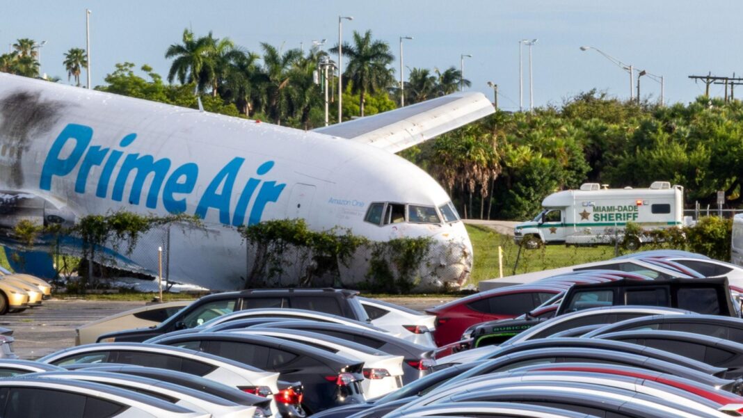Pilot warned Amazon cargo plane going too fast before deadly crash, data shows A Prime Air plane rests next to a car park after crashing. The nose of the plane is crumpled and there are black marks on the side of the plane.