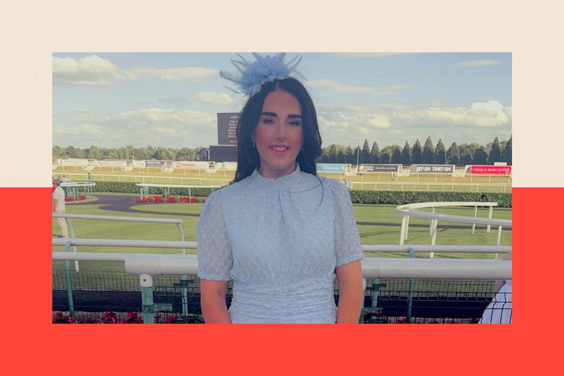 Ibbie standing at a race course