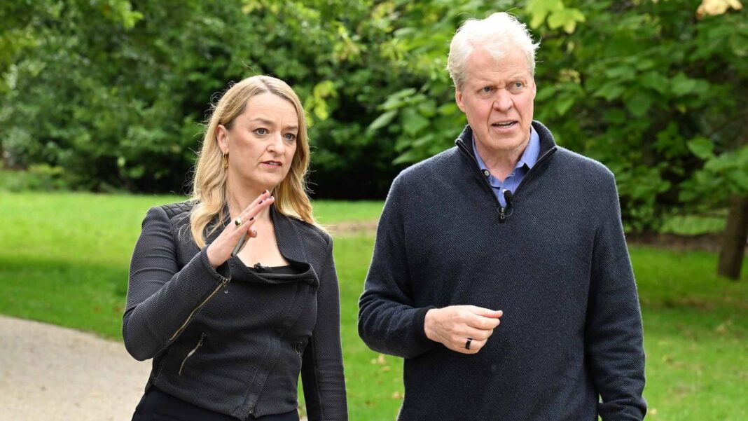 Kuenssberg: I asked Earl Spencer who we should believe – him or the King? On the left, Laura Kuenssberg wearing a black top and trousers, walks through a garden raising her right hand. On the right, Earl Spencer walks next to her in a dark jacket and tan trousers. Cameramen are by their side filming.
