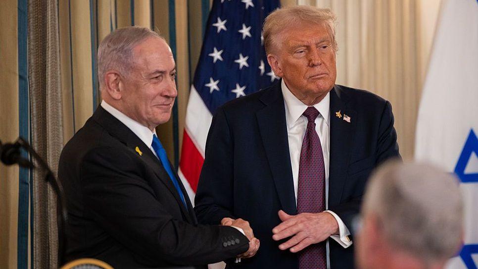 Trump and Netanyahu shaking hands in July at the White House