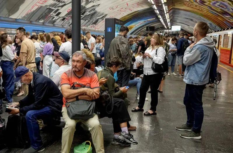 Commuters are pictured inside an underground station in Kyiv