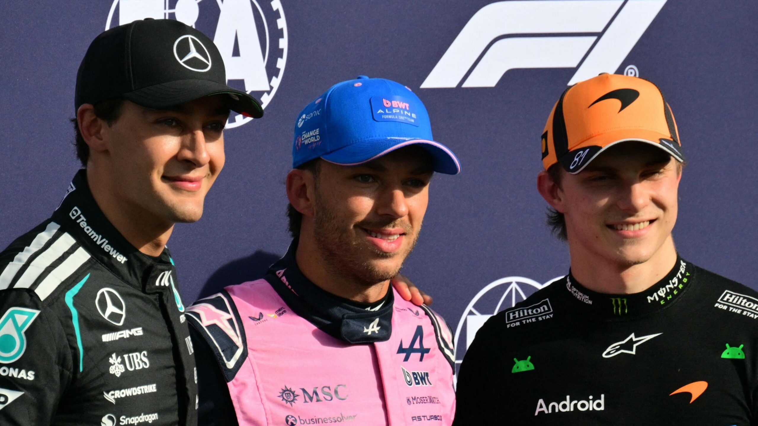 The top three from Italian Grand Prix qualifying - Pierre Gasly, George Russell and Oscar Piastri - pose for photographs after the session