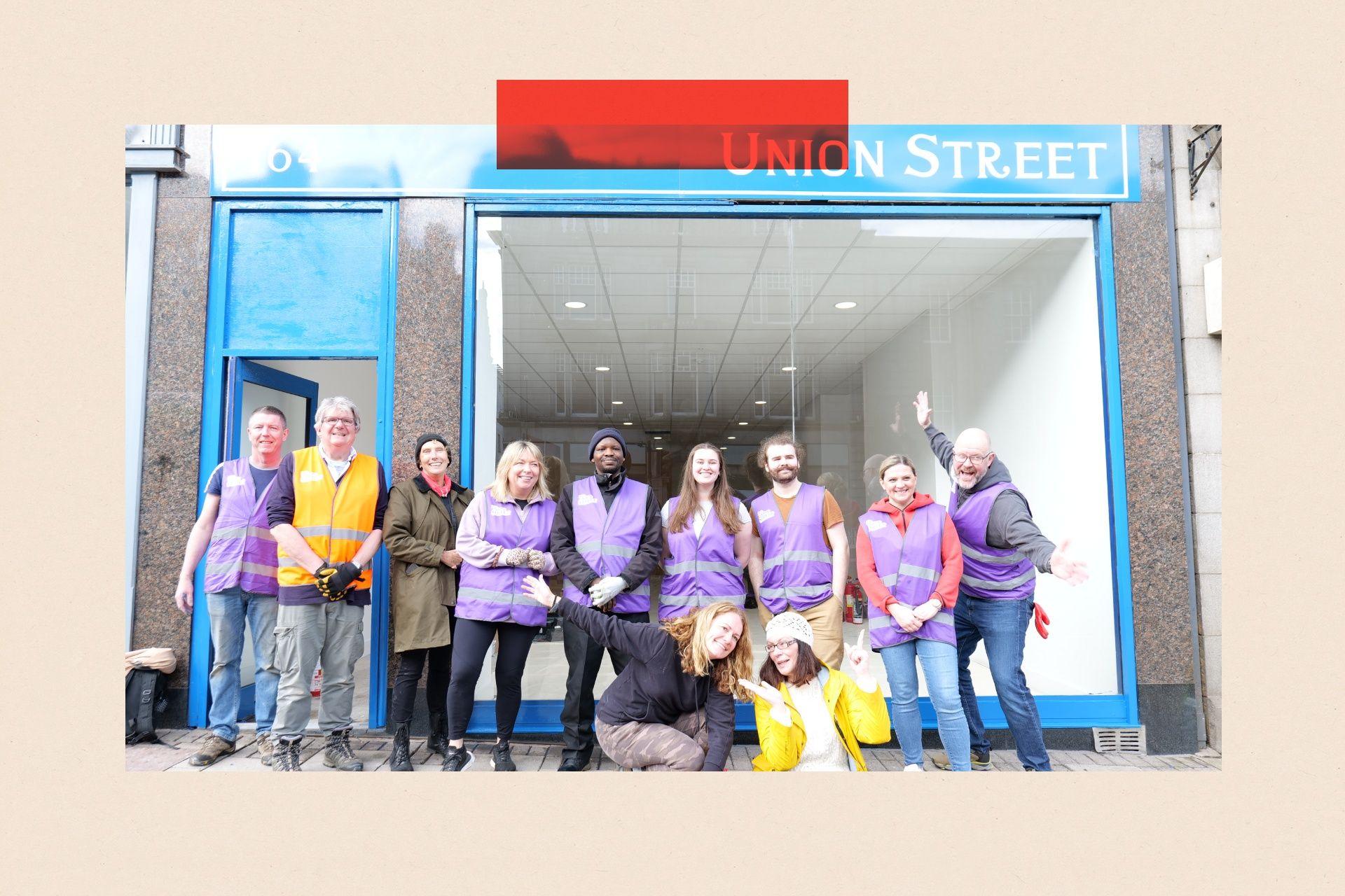 Volunteers in purple clothing
