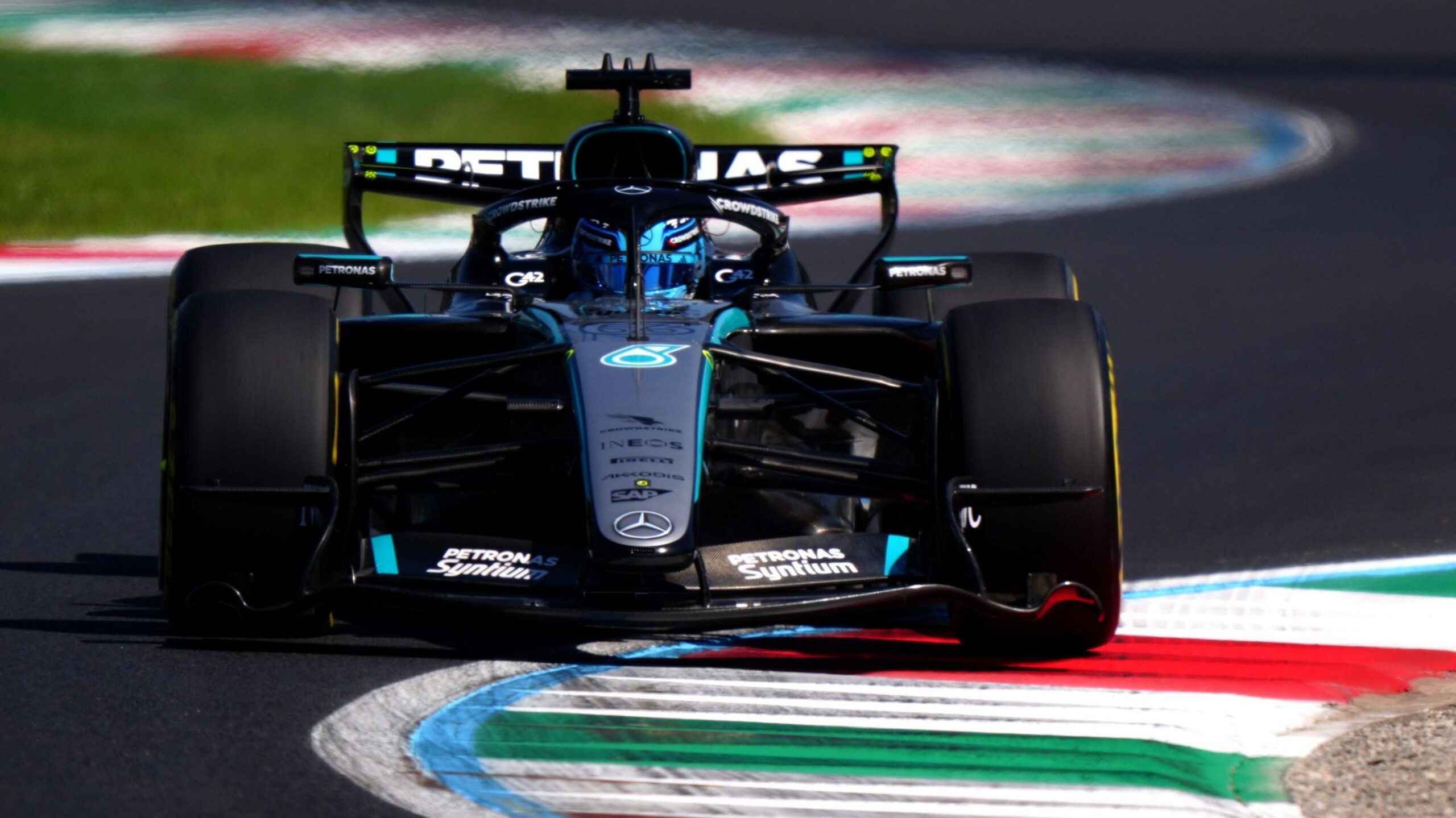 Mercedes' George Russell drives over a kerb during Italian Grand Prix first practice
