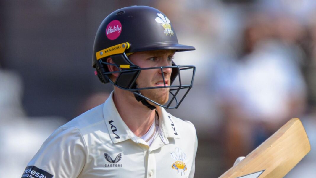 Josh Blake wearing a Surrey helmet