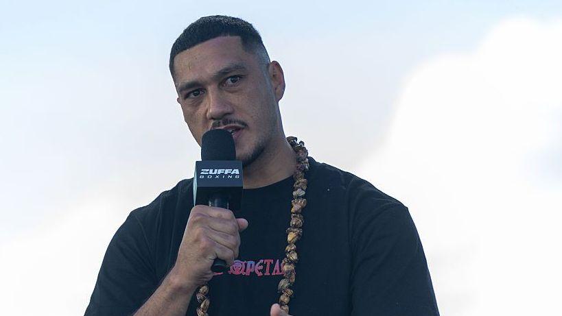 Jai Opetaia speaks into the microphone at a news conference