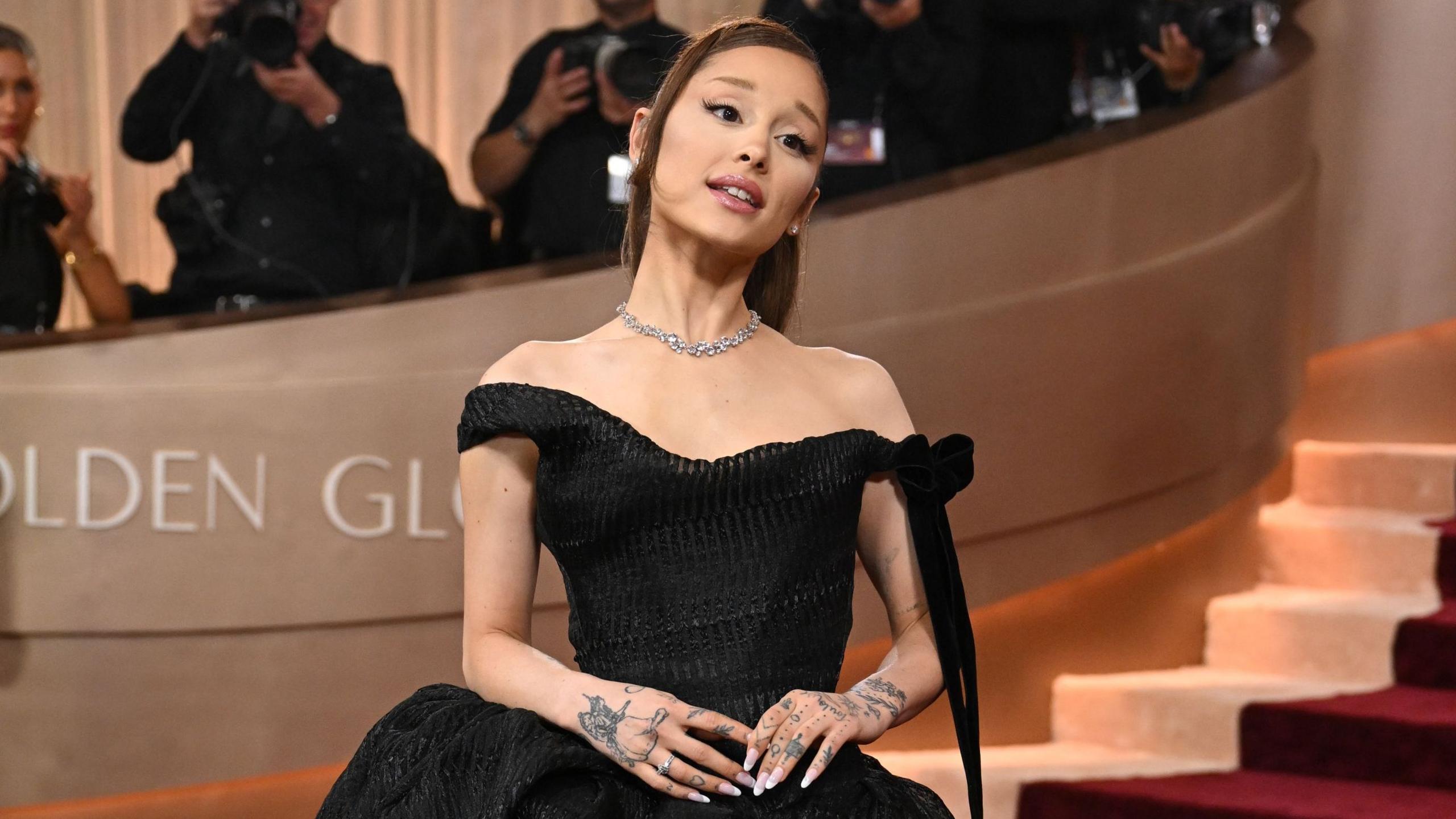 Ariana Grance in a black off the shoulder dress at this year's Golden Globe awards