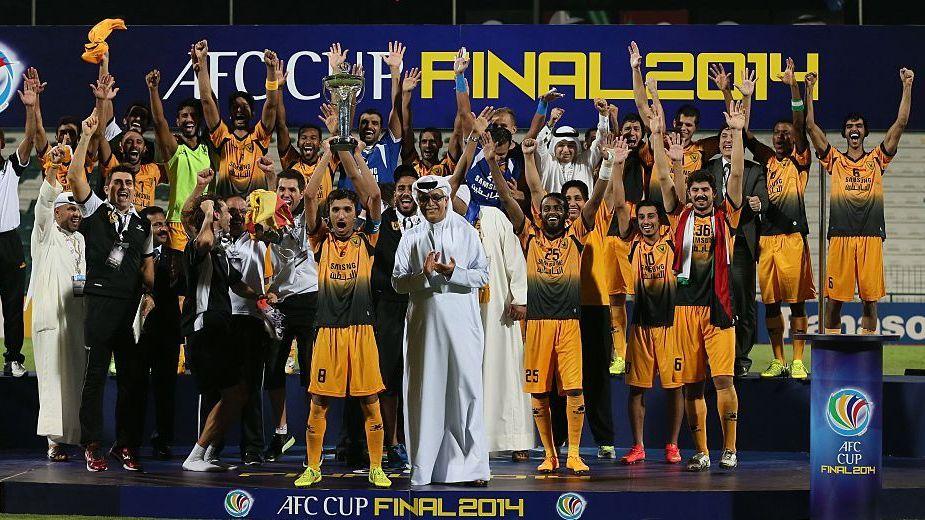 Al Qadsia lifting the trophy after winning the AFC Cup in 2014