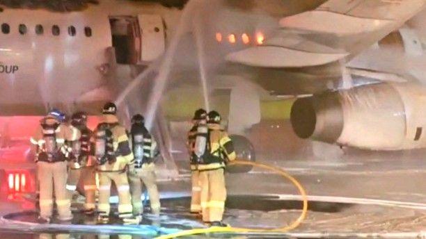 Firefighters tackle an aircraft fire
