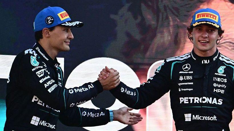 George Russell congratulates Kimi Antonelli on the podium