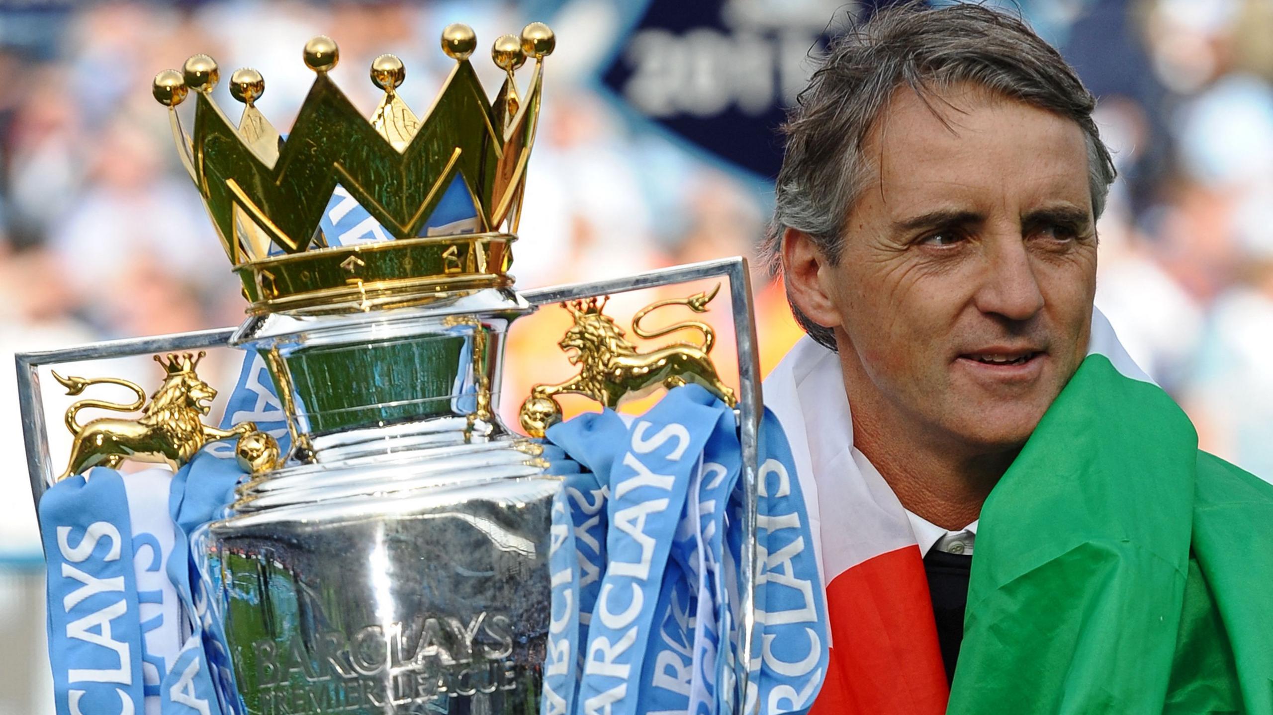 Manchester City manager Roberto Mancini with the Premier League trophy