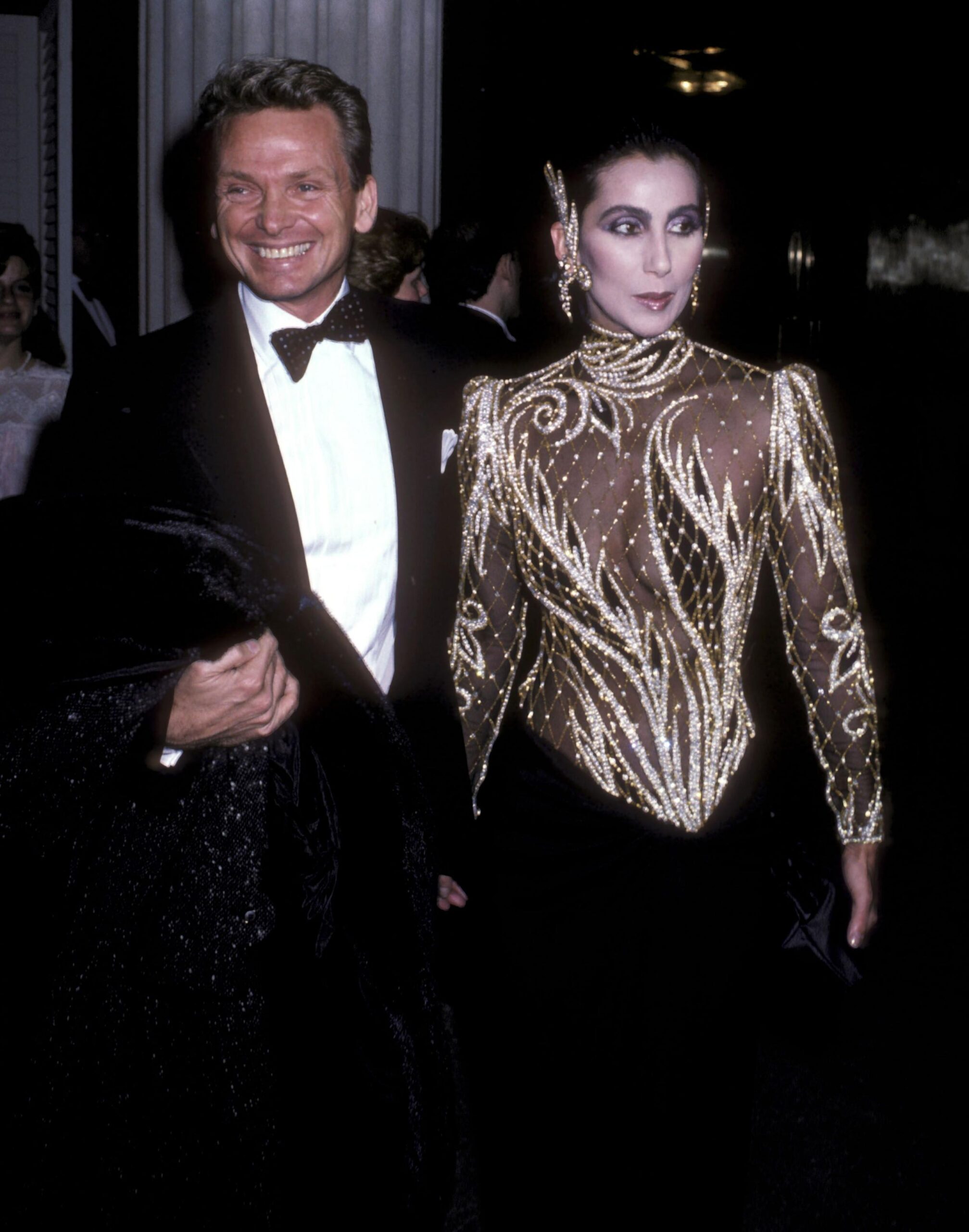 Fashion designer Bob Mackie and singer/actress Cher attend The Metropolitan Museum's Costume Institute Gala Exhibition of "Costumes of Royal India" on December 9, 1985 at The Metropolitan Museum of Art in New York City.