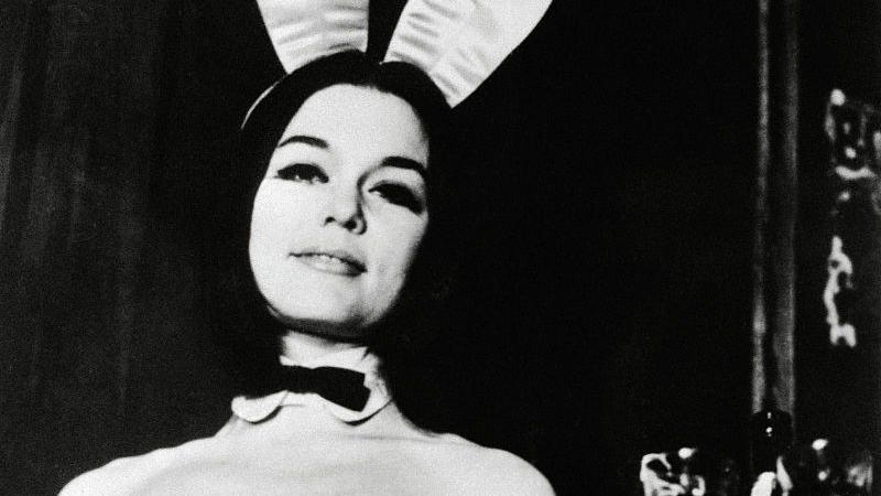 Gloria Steinem as a Playboy Bunny holding a tray