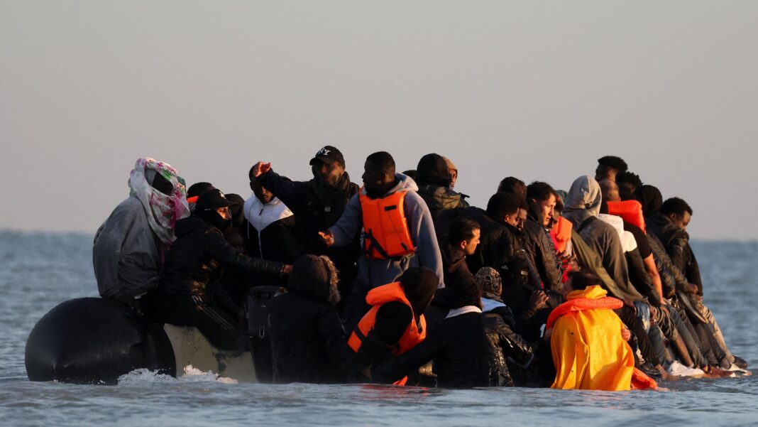 Migrants on an inflatable dinghy leaving the coast of northern France at Gravelines, near Calais