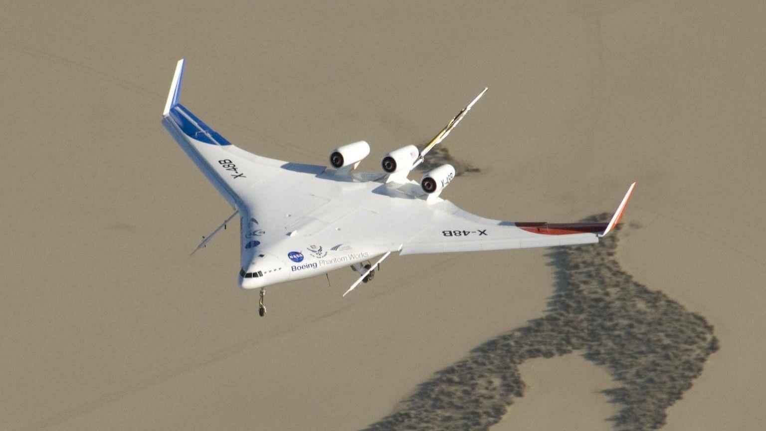 The X-48 flying. The wings and body merge, to create an almost triangular-shaped aircraft.