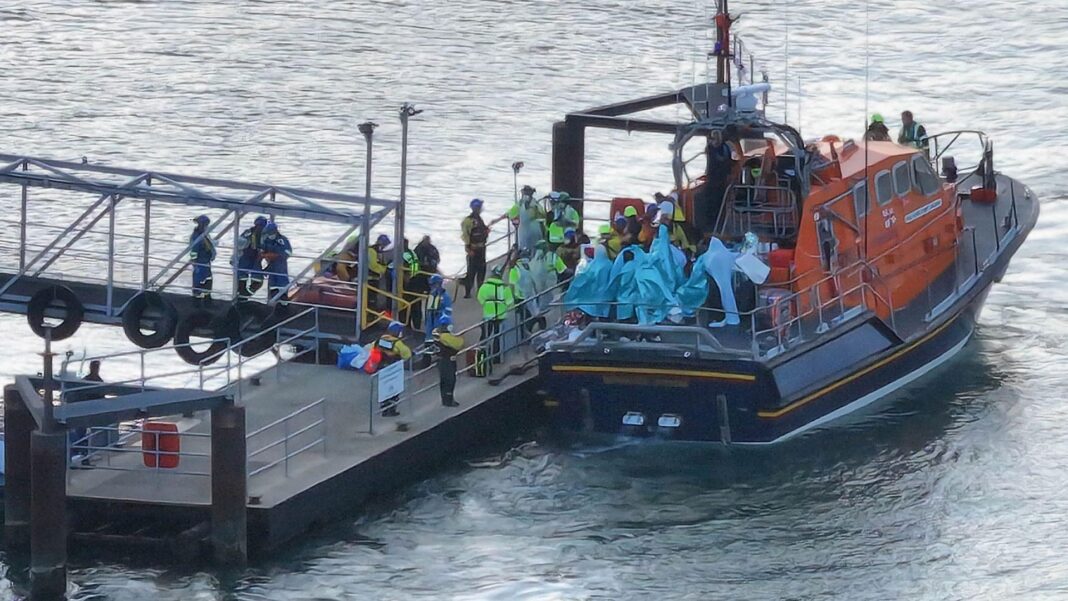 Rival protests in Portsmouth as face masks banned People wrapped in blankets on the back of an RNLI lifeboat moored by a pontoon at Eastney, Portsmouth, on 6.9.26
