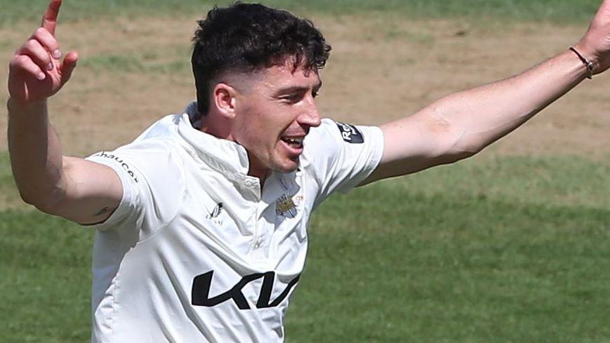 Matt Fisher celebrates taking a wicket