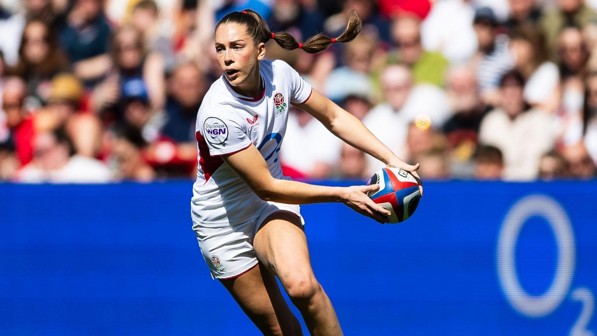 Holly Aitchison prepares to pass while playing for England