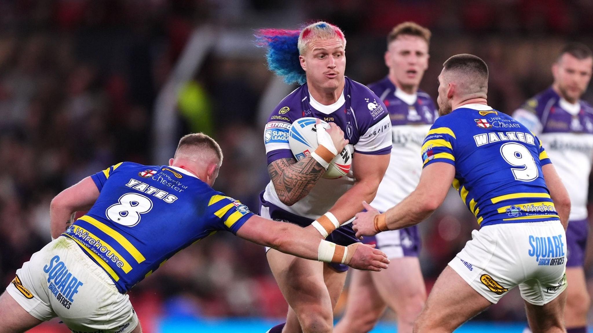 Caius Faatili (centre) in action for Wakefield against Warrington in the Super League Grand Final