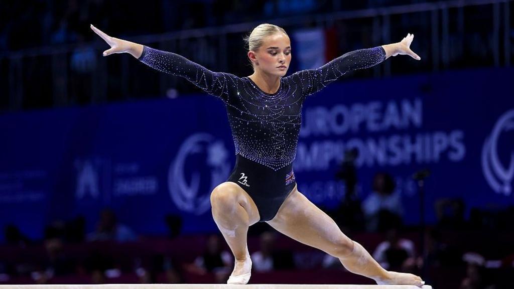 Ruby Evans competing on the balance beam in the 2026 European Championships