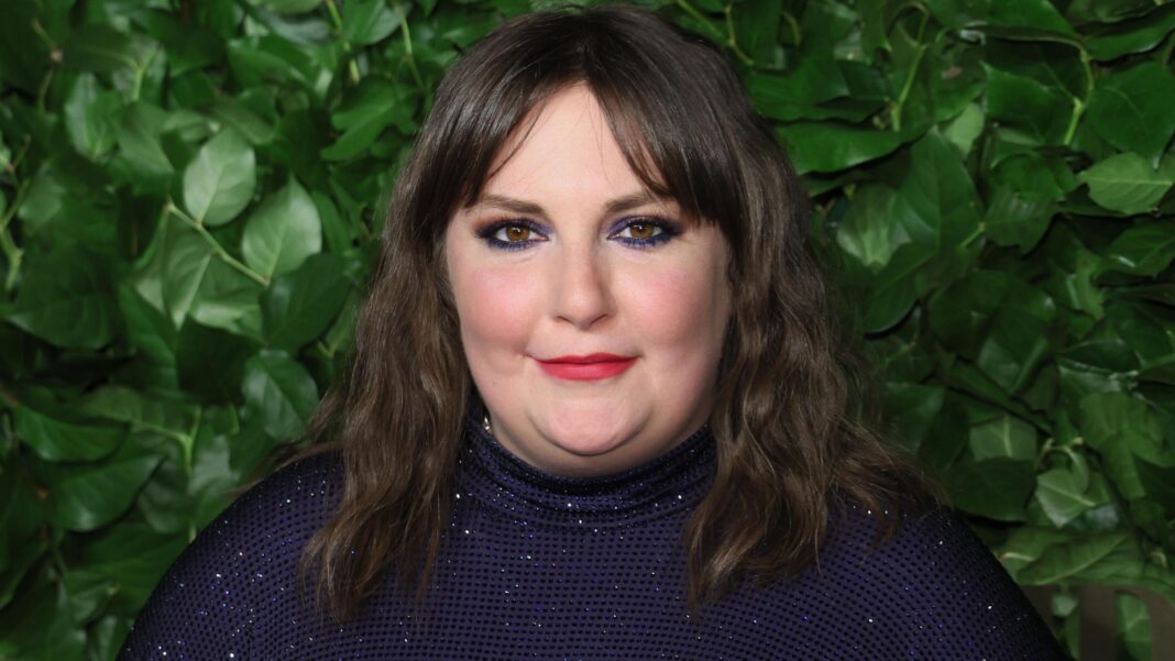 Lena Dunham’s Girls to return for limited HBO run Lena Dunham - a woman with black hair and red lipstick - smiles at the camera wit a backdrop of foliage