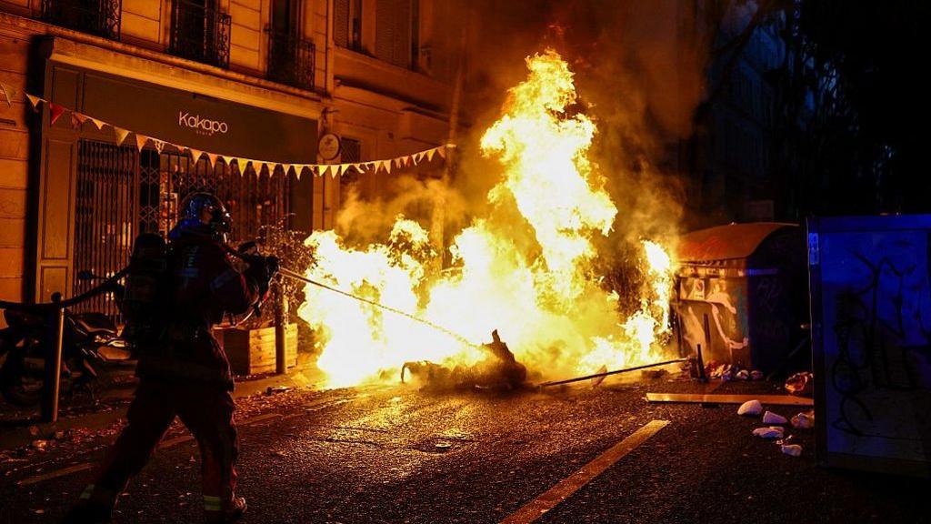 A burning makeshift street barricade in the southern French city of Marseille. Photo: 24 October 2026