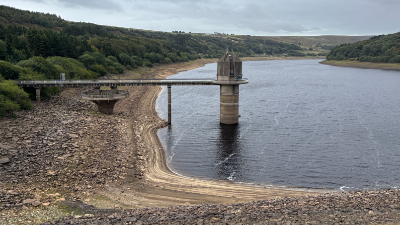 Scammonden reservoir in West Yorkshire, with parched dry banks.