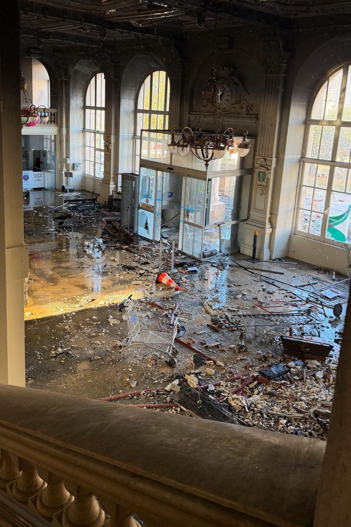 Damage to the scene at Limoges town hall seen from a staircase
