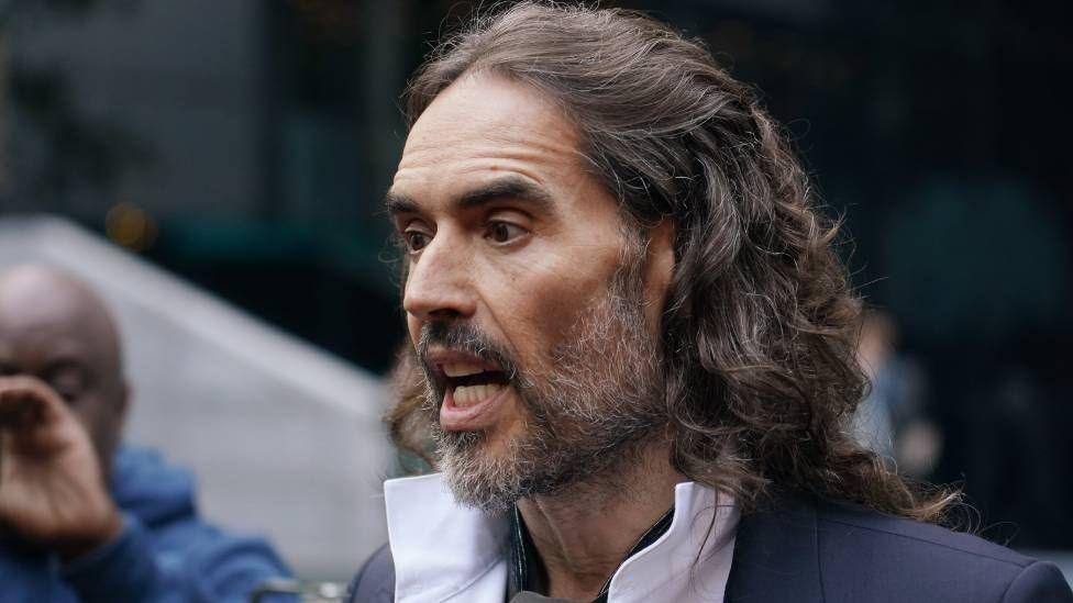 Russell Brand arrives at court ahead of his trial, where he faces rape and sexual assault charges at Southwark Crown Court on October 28, 2026 in London, England