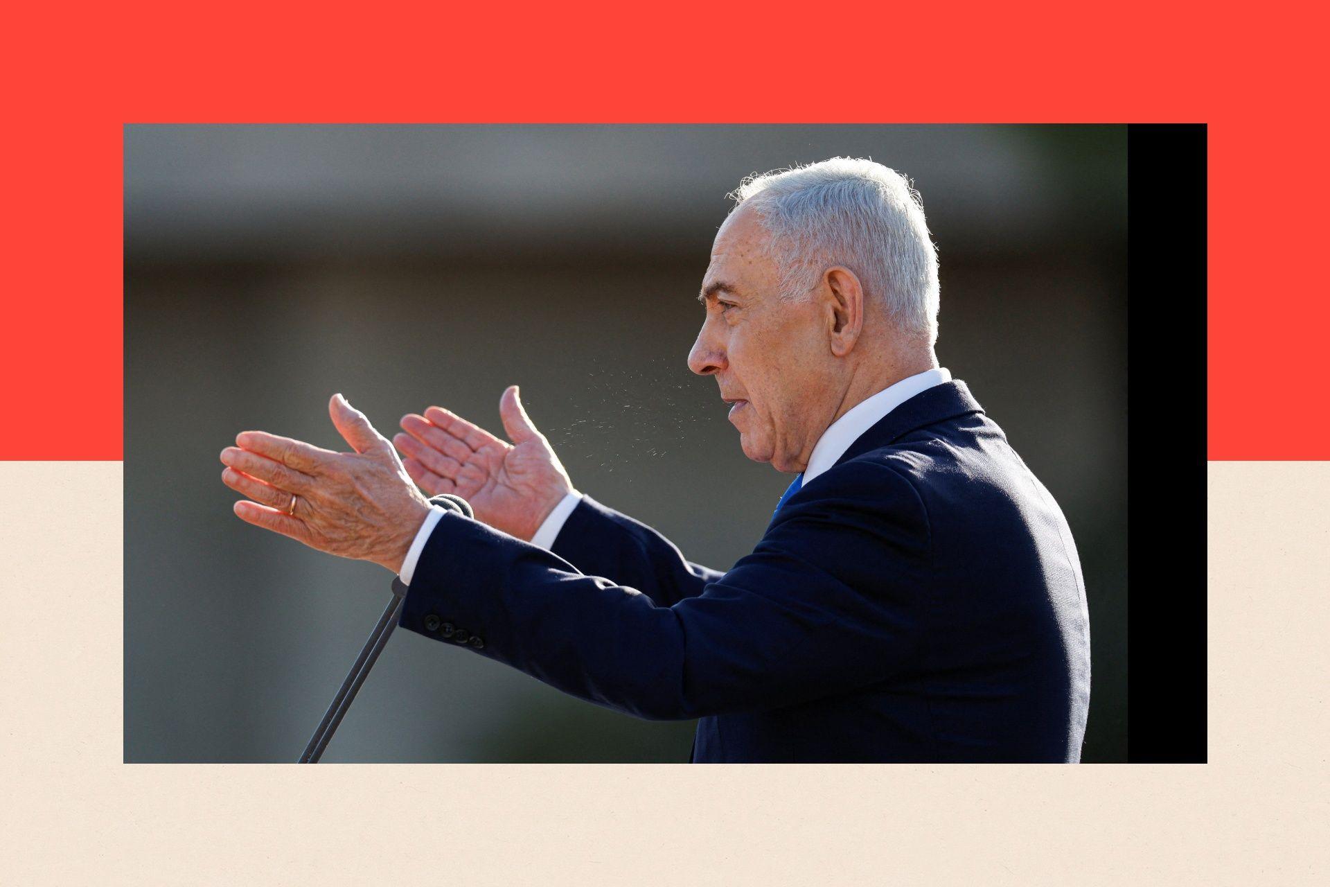 A side-on picture of Benjamin Netanyahu speaking at a lectern